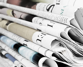 Pile of folded newspapers